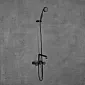 Wall-mounted bath or shower faucet in black color