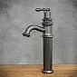 Retro-style sink faucet made of brass in black color, height 335mm, spout length 130mm