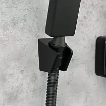 Modern-look wall-mounted bathtub faucet with a shower handset, height 15 cm, width 20 cm, color black, finish brushed